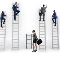 Four male work ladders go high, female one is not highlighting gender discrimination
