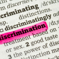 Paper that reads discrimination