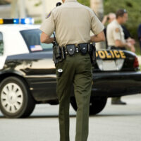 Officer walking towards car Officer walking towards car