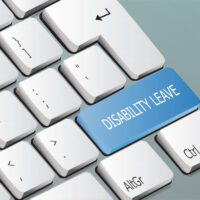 Disability Leave written on the keyboard button