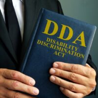 Lawyer is holding Disability Discrimination Act DDA.