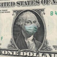 COVID-19 coronavirus in USA, ONE Dollar money bill with George Washington wearing healthcare surgical mask. Coronavirus in United States quarantine and global recession. Global economy hit by Covid19.