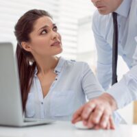 Unhappy nice woman looking at her boss Unhappy nice woman looking at her boss