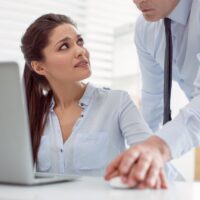 Unhappy nice woman looking at her boss