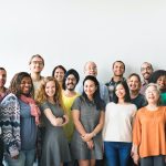 A team of diverse people doing a group photo