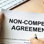 Man is signing Non compete agreement